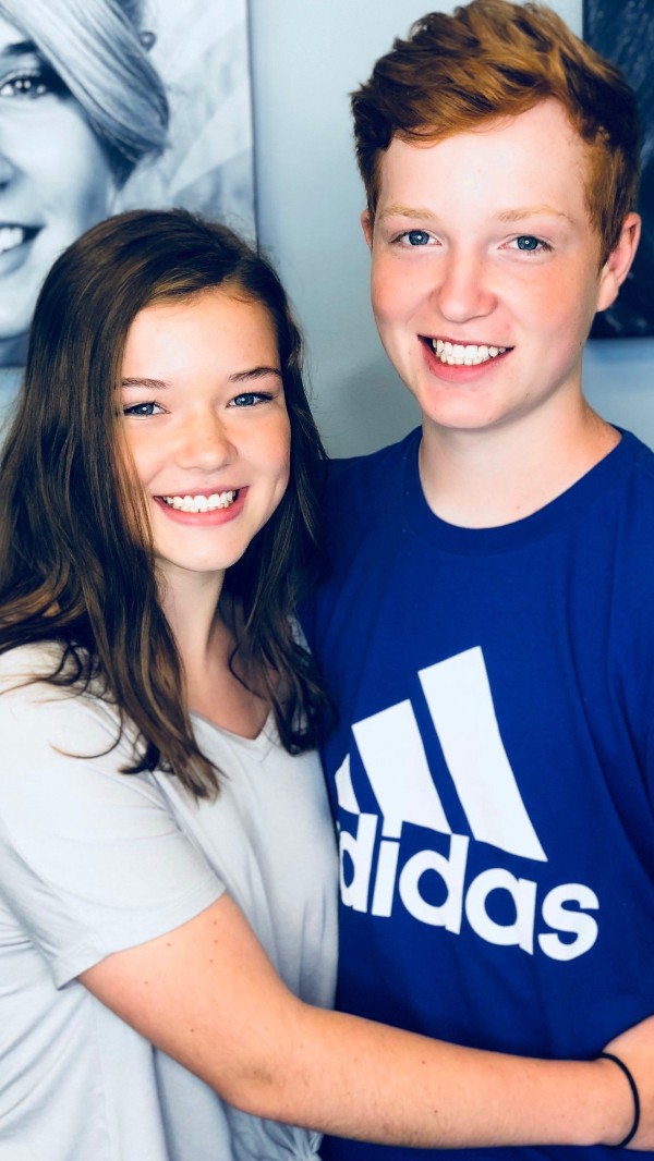 Girl and boy smiling together